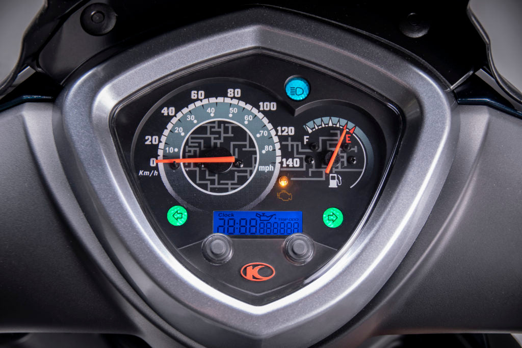 Kymco scooter dashboard with speedometer and digital display in Aegina